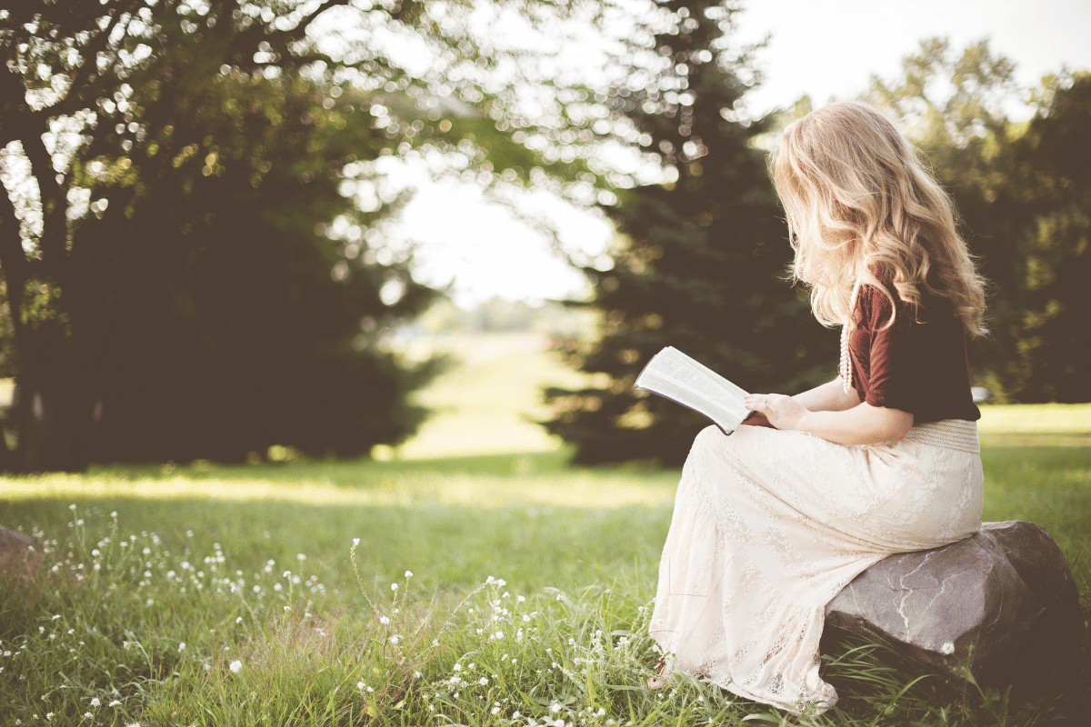 woman reading outside